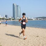 성우하이텍배 KNN 환경마라톤 10km 코스에서 바라본 광안리 해수욕장과 마린시티의 풍경
